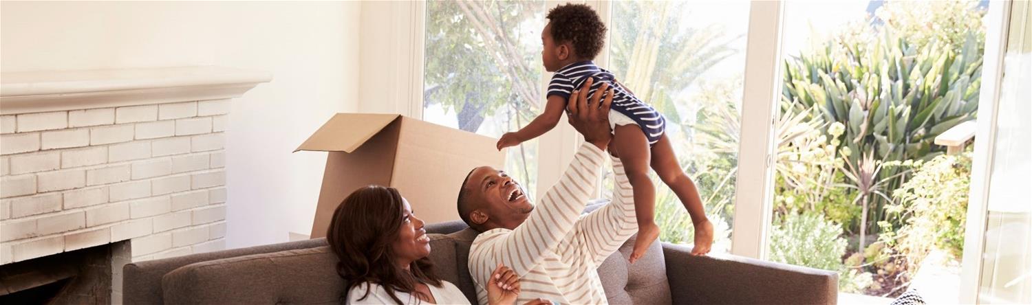 Happy Smiling Family in New Home