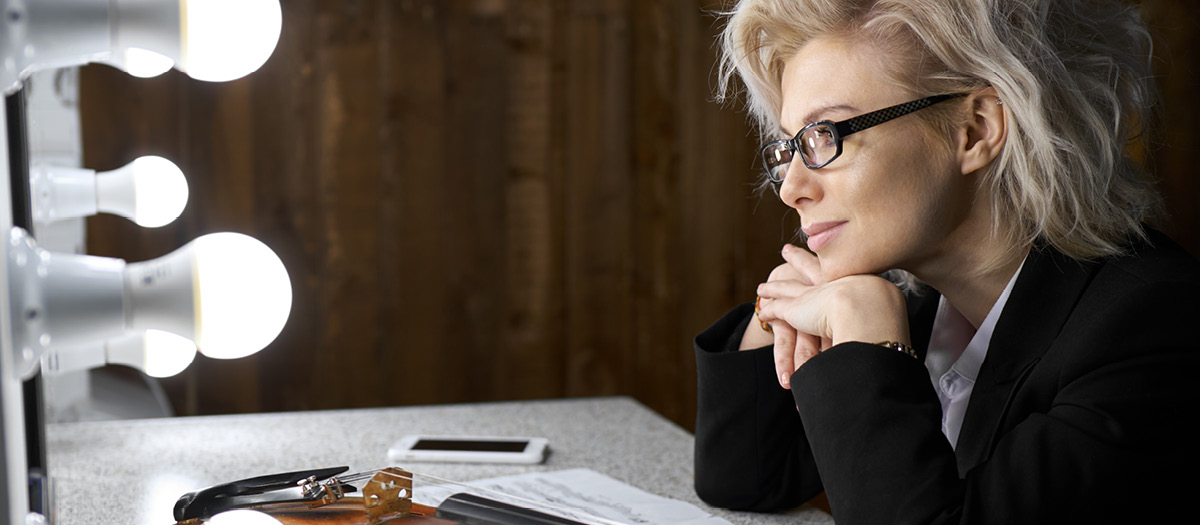 woman thinking about her glasses